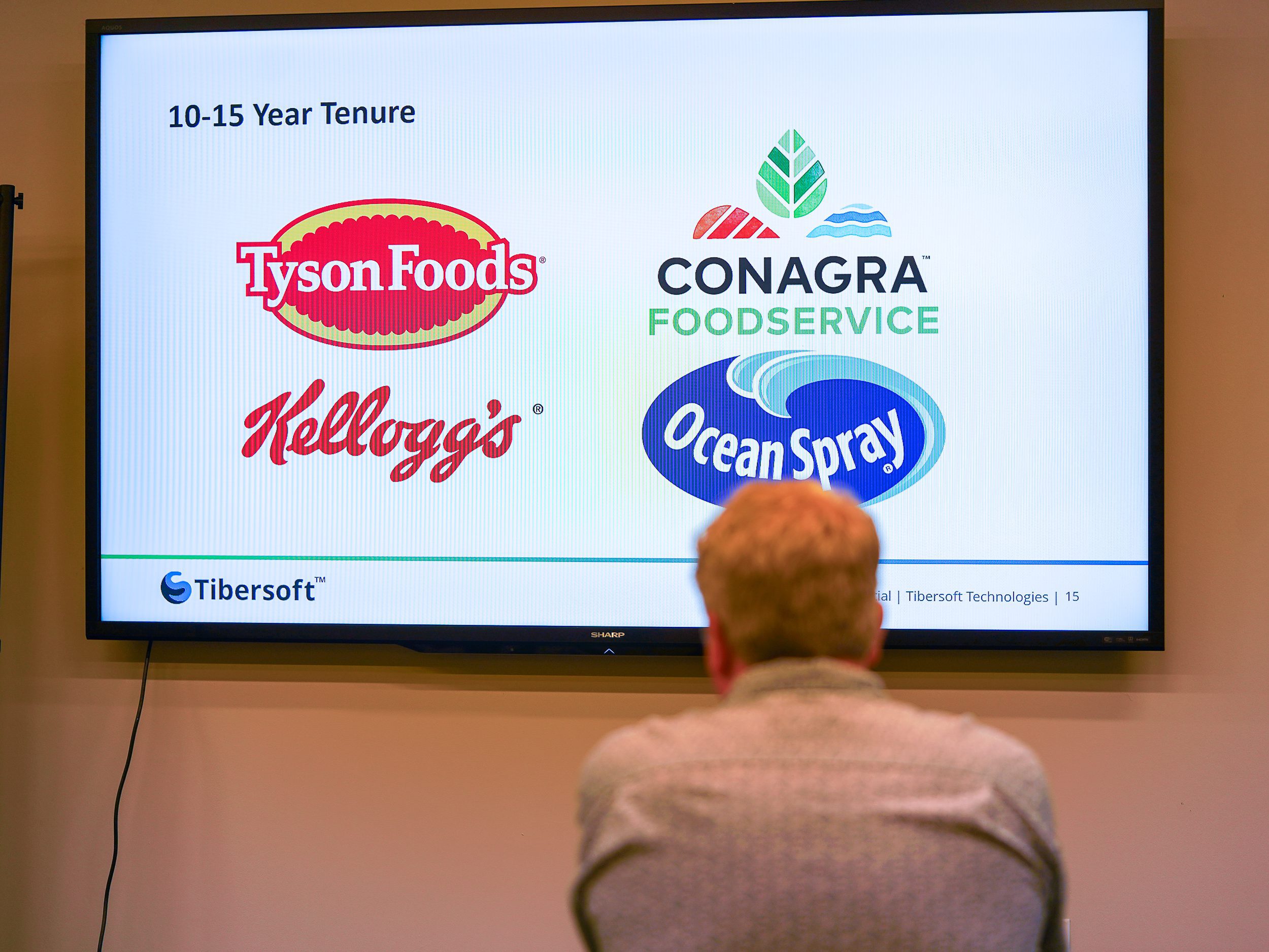 Tibersoft townhall presentation slide showing 10-15 year client partners including Tyson Foods, Conagra Foodservice, Kellogg's, and Ocean Spray